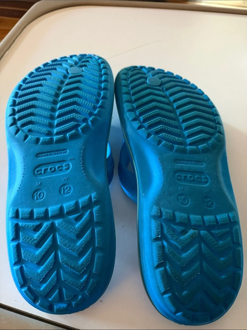 CROCS blue flip flops.  Men’s size 10. Fair condition.